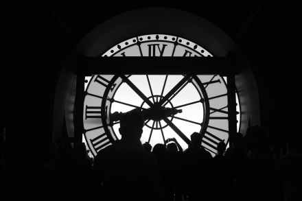 silhouette of people in musee d orsay clock